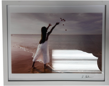 Load image into Gallery viewer, Framed artwork of a woman in a white dress on a beach, reaching towards the sky.

